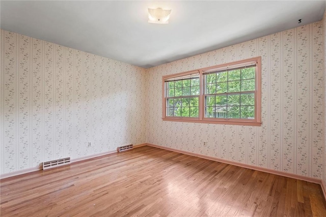 5811 W 85th Ter, Overland Park, KS 66207 - empty room with wood finished floors and baseboards