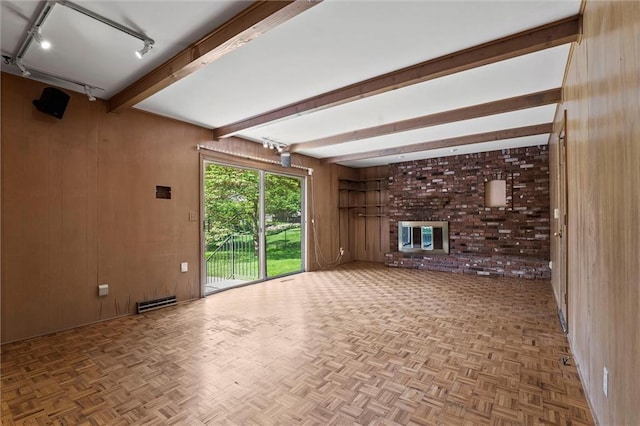 5811 W 85th Ter, Overland Park, KS 66207 - unfurnished living room with wood walls, track lighting, and beam ceiling