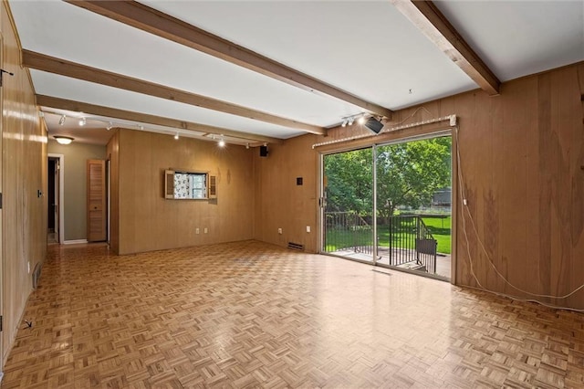 5811 W 85th Ter, Overland Park, KS 66207 - spare room featuring wooden walls, beamed ceiling, and track lighting