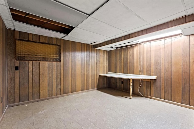5811 W 85th Ter, Overland Park, KS 66207 - finished basement with wood walls, tile patterned floors, baseboards, and a drop ceiling