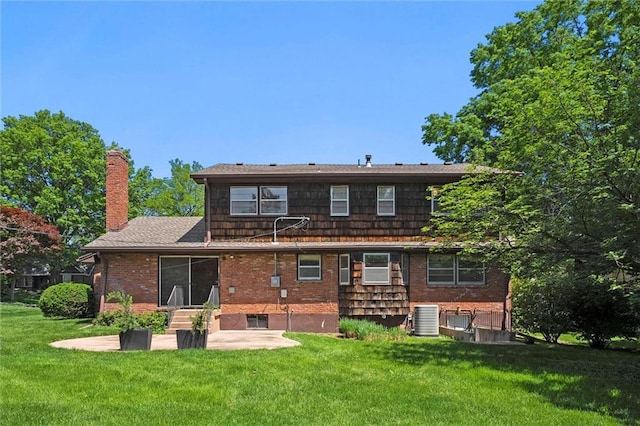 5811 W 85th Ter, Overland Park, KS 66207 - back of house featuring cooling unit, a chimney, a yard, a patio area, and entry steps