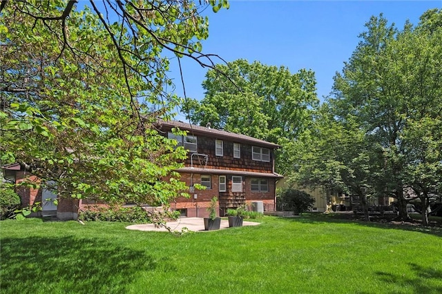 5811 W 85th Ter, Overland Park, KS 66207 - rear view of house featuring a yard, a patio, and cooling unit