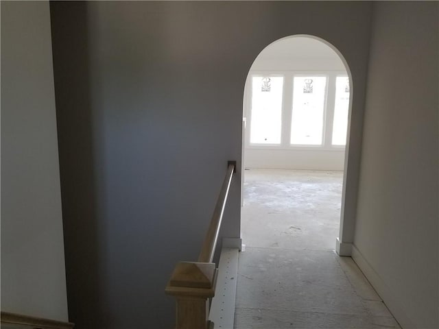 14463 Aurora Ln, Basehor, KS 66007 - hallway with arched walkways and unfinished concrete floors