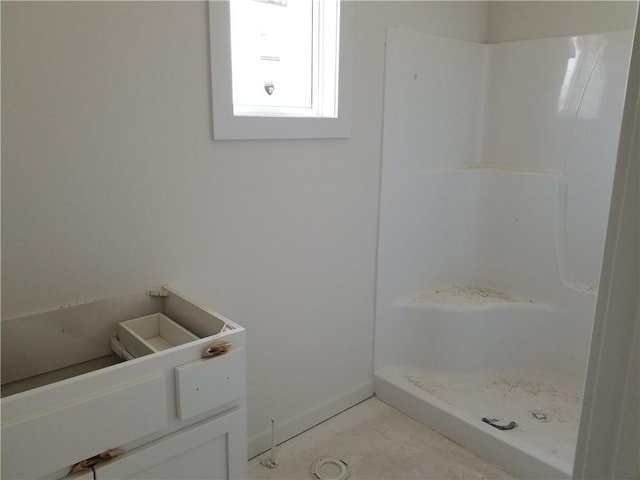 14463 Aurora Ln, Basehor, KS 66007 - full bathroom featuring a shower stall and baseboards