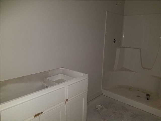14463 Aurora Ln, Basehor, KS 66007 - bathroom with vanity, unfinished concrete floors, and shower / bath combination
