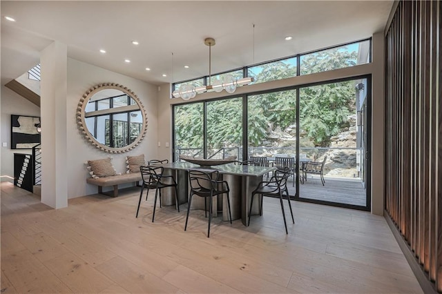 dining area featuring light wood-type flooring and recessed lighting