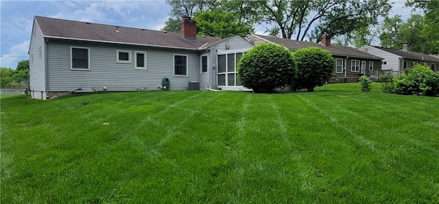 4006 W 63rd St, Prairie Village, KS 66208 - back of property featuring a lawn, a chimney, and cooling unit