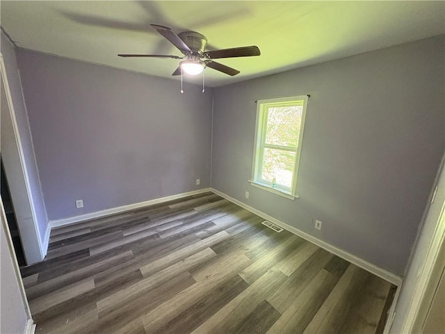 710 N Willis Ave, Independence, MO 64050 - spare room featuring ceiling fan, wood finished floors, and baseboards