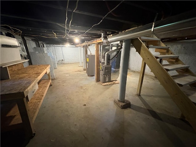 710 N Willis Ave, Independence, MO 64050 - unfinished basement with water heater, stairway, and heating unit