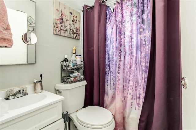 2713-2715 Benton Blvd, Kansas City, MO 64128 - bathroom with vanity, toilet, and curtained shower