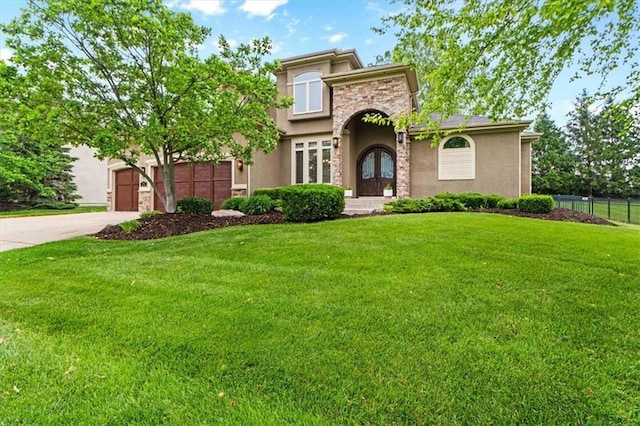 16249 Stearns St, Overland Park, KS 66221 - view of front of house with driveway, stucco siding, an attached garage, french doors, and stone siding