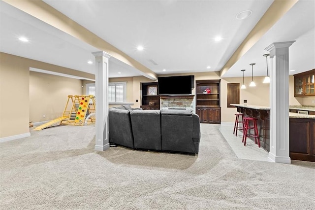 16249 Stearns St, Overland Park, KS 66221 - living area featuring light carpet, ornate columns, a bar, baseboards, and recessed lighting