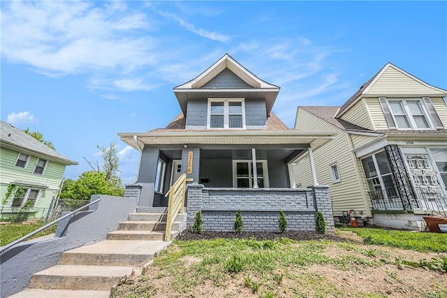 2206 E 30th St, Kansas City, MO 64109 - view of front of home featuring covered porch