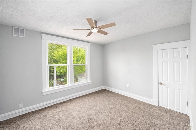 2206 E 30th St, Kansas City, MO 64109 - carpeted empty room featuring ceiling fan and a textured ceiling
