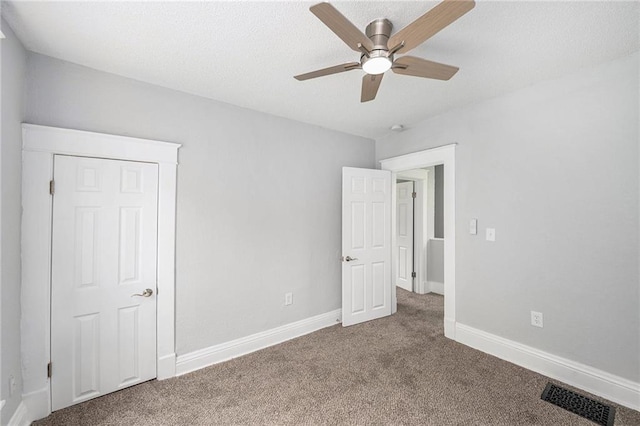 2206 E 30th St, Kansas City, MO 64109 - unfurnished bedroom with carpet floors and ceiling fan