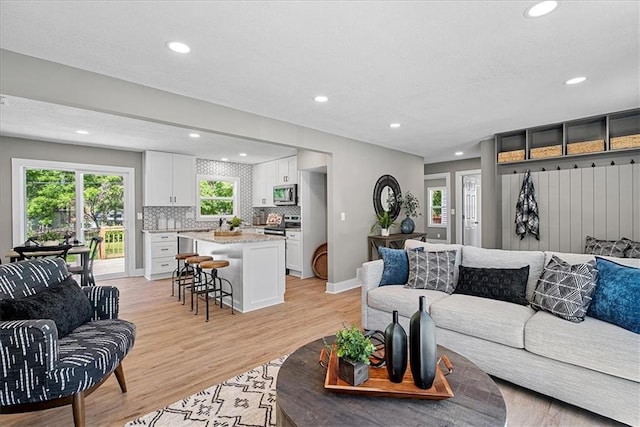 11424 W 68th Pl, Shawnee, KS 66203 - living area featuring recessed lighting, light wood finished floors, and baseboards