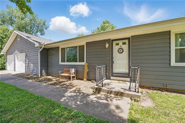 single story home featuring an attached garage