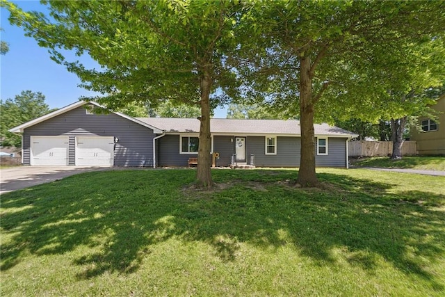 ranch-style home with an attached garage and driveway