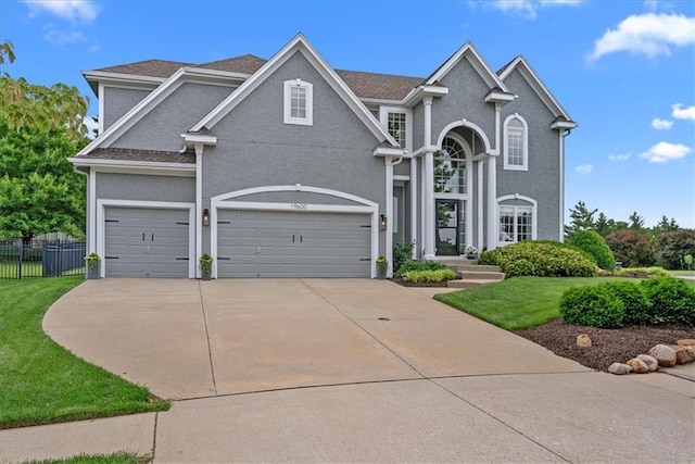 19600 W 98th St, Lenexa, KS 66220 - traditional-style house with driveway and stucco siding