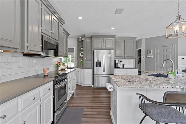 19600 W 98th St, Lenexa, KS 66220 - kitchen featuring stainless steel appliances, a sink, gray cabinetry, open shelves, and dark wood finished floors