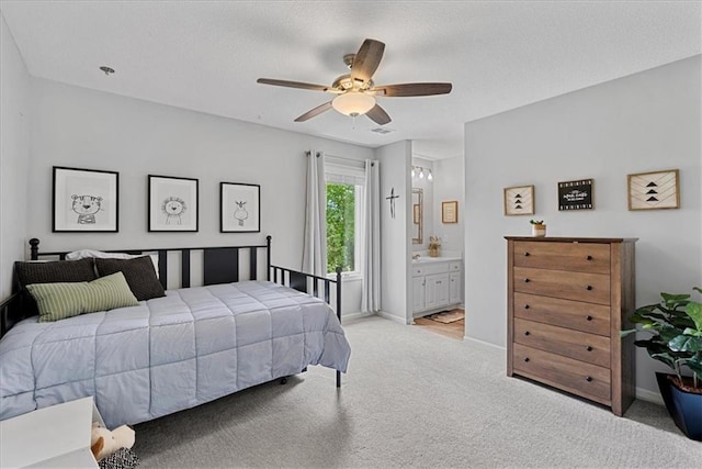 19600 W 98th St, Lenexa, KS 66220 - bedroom with light carpet, baseboards, ceiling fan, and connected bathroom