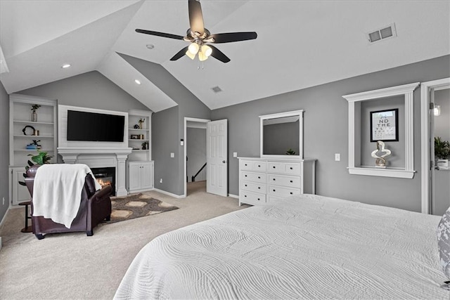 19600 W 98th St, Lenexa, KS 66220 - bedroom with carpet floors, vaulted ceiling, a glass covered fireplace, ceiling fan, and recessed lighting