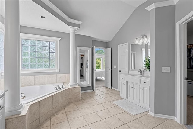 19600 W 98th St, Lenexa, KS 66220 - bathroom featuring decorative columns, vanity, a garden tub, lofted ceiling, and a spacious closet