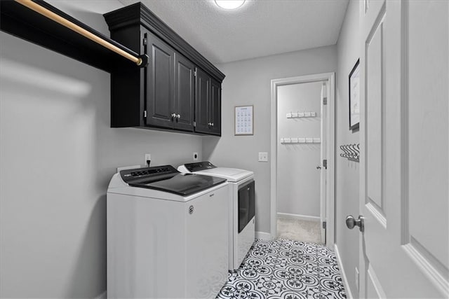19600 W 98th St, Lenexa, KS 66220 - laundry area featuring washer and dryer, cabinet space, a textured ceiling, and baseboards