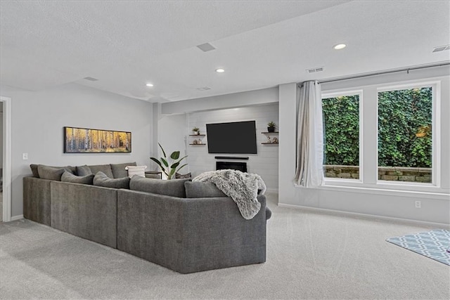 19600 W 98th St, Lenexa, KS 66220 - carpeted living room with recessed lighting, baseboards, and a textured ceiling