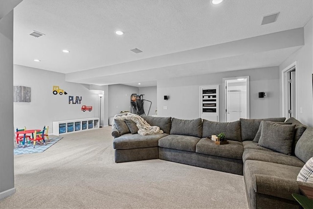 19600 W 98th St, Lenexa, KS 66220 - living room featuring carpet floors, a textured ceiling, and recessed lighting