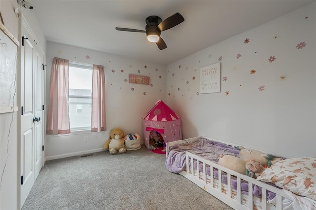 bedroom featuring carpet flooring, baseboards, and a ceiling fan