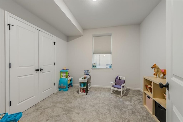 playroom with carpet flooring and baseboards