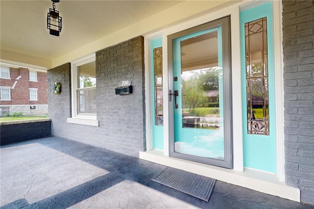 property entrance featuring covered porch