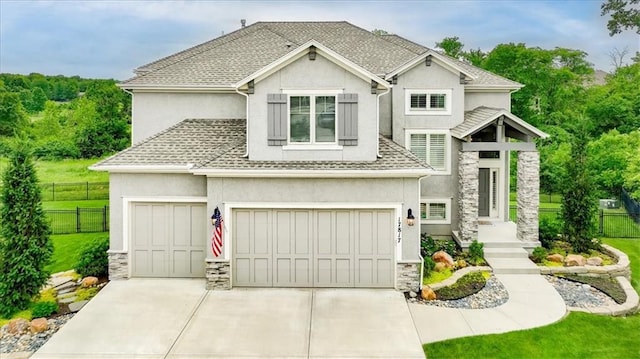 17817 Grandview St, Overland Park, KS 66013 - view of front of home featuring stucco siding, stone siding, concrete driveway, a garage, and a shingled roof