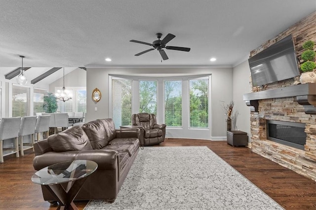 17817 Grandview St, Overland Park, KS 66013 - living area with a fireplace, dark wood-style flooring, a ceiling fan, a chandelier, and ornamental molding