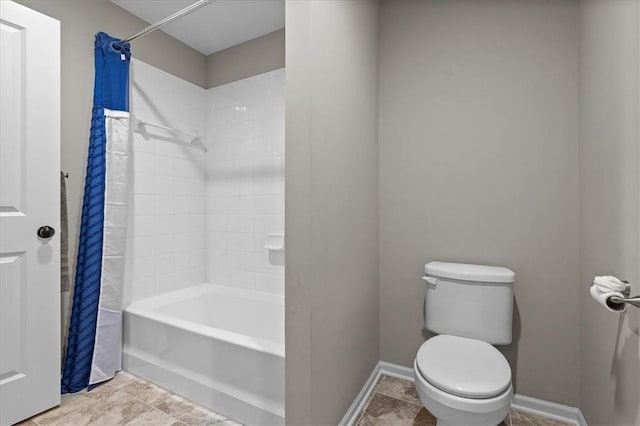 17817 Grandview St, Overland Park, KS 66013 - bathroom with shower / tub combo, toilet, and baseboards