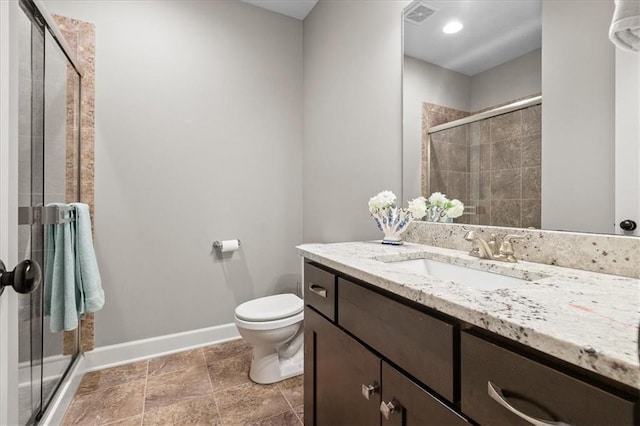 17817 Grandview St, Overland Park, KS 66013 - bathroom featuring vanity, baseboards, toilet, and a stall shower