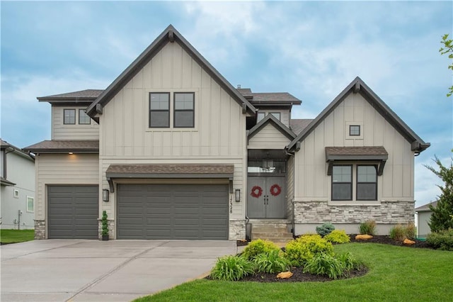 17328 Richards St, Overland Park, KS 66221 - view of front of property featuring board and batten siding, driveway, a front yard, stone siding, and an attached garage