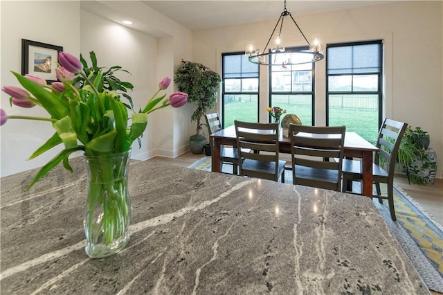 17328 Richards St, Overland Park, KS 66221 - dining area featuring healthy amount of natural light, a chandelier, and baseboards