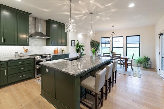 17328 Richards St, Overland Park, KS 66221 - kitchen with wall chimney exhaust hood, double oven range, green cabinets, a sink, and recessed lighting