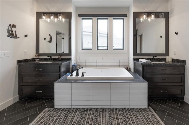 17328 Richards St, Overland Park, KS 66221 - full bath with two vanities, a bath, and baseboards