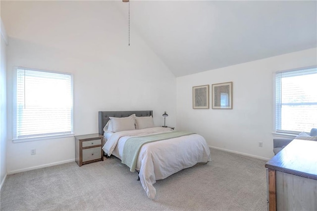 bedroom featuring carpet floors, lofted ceiling, and baseboards