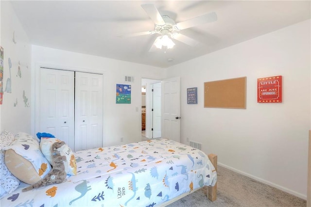 bedroom with carpet, a closet, baseboards, and a ceiling fan