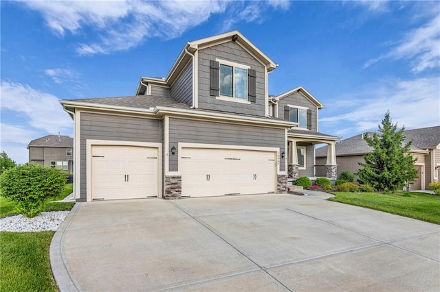 16967 S Laurelwood St, Olathe, KS 66062 - view of front of house featuring driveway, a garage, stone siding, and covered porch