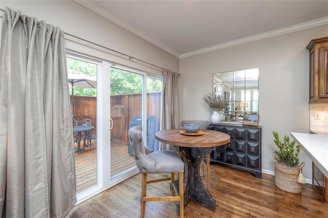16141 Linden St, Stilwell, KS 66085 - dining space with wood finished floors, ornamental molding, and baseboards
