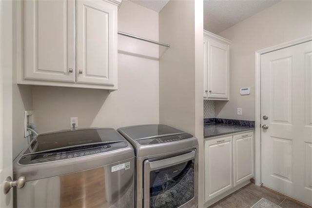 16141 Linden St, Stilwell, KS 66085 - laundry area featuring cabinet space and washer and dryer