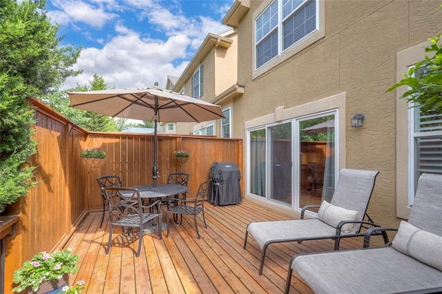 16141 Linden St, Stilwell, KS 66085 - wooden deck featuring outdoor dining space and area for grilling