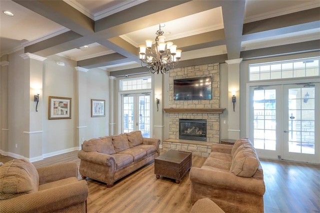 16141 Linden St, Stilwell, KS 66085 - living room with french doors, ornamental molding, coffered ceiling, a chandelier, and beam ceiling