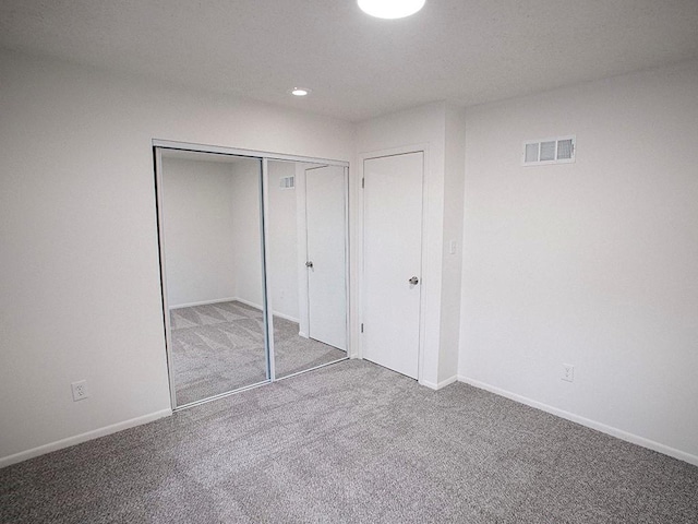 10921 Mckinley Dr, Kansas City, MO 64134 - unfurnished bedroom with carpet floors, a closet, baseboards, and recessed lighting