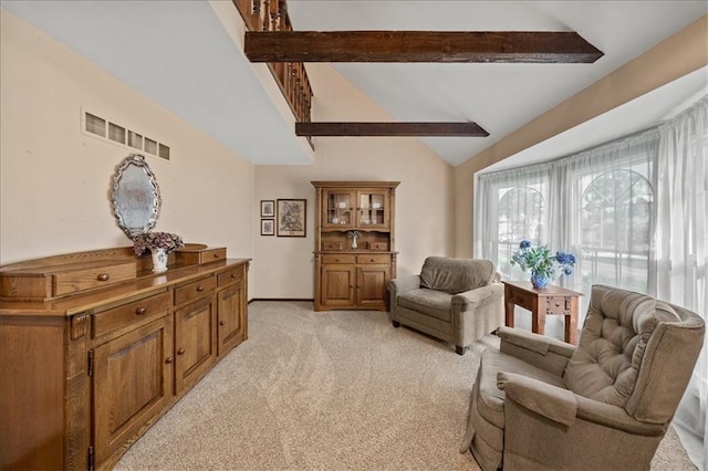 living area featuring light colored carpet